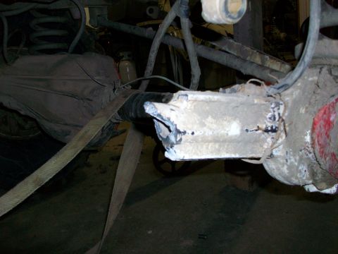 1992 Ford F-350 - Close-up of a damaged rear axle housing, possibly from a truck or SUV.