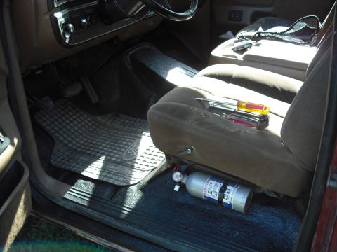 1988 Ford Bronco - Tools and a fire extinguisher are visible inside the vehicle's interior.