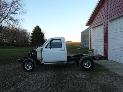 1994 Ford F-150 - Front clip and box are pulled off but the engine is still in the truck at this point.