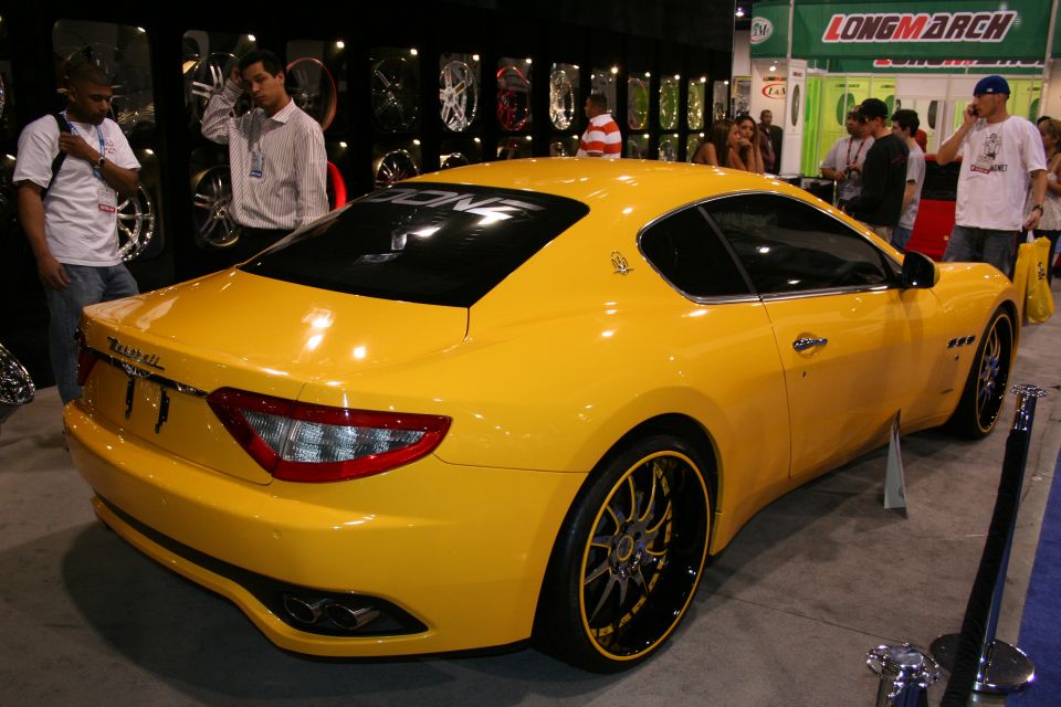 Yellow Maserati GranTurismo coupe with custom wheels and tinted windows