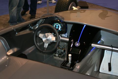 1998 Ford Crown Victoria - The interior of a car features a modern digital dashboard and a prominent blue light strip.