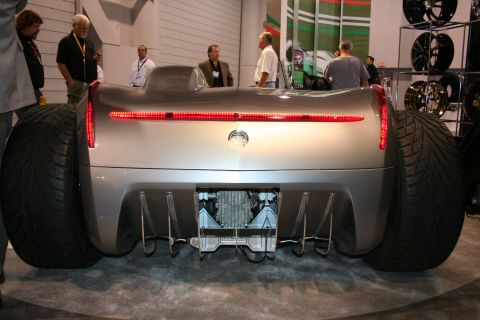 1998 Ford Crown Victoria - Custom concept car rear view with massive tires and unique exhaust setup.