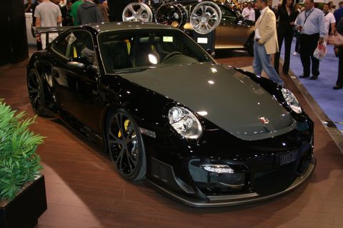 1998 Ford Crown Victoria - Customized Porsche 911 GT2 RS on display at an auto show.