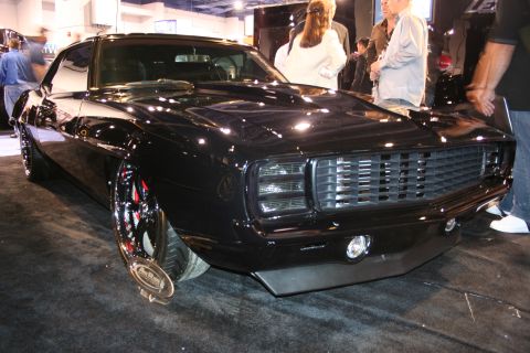 Black custom car front 3/4 view with custom grille and headlights