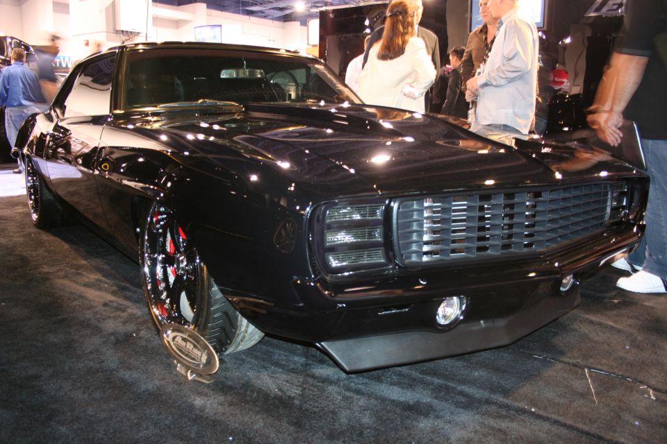 Black custom car front 3/4 view with custom grille and headlights