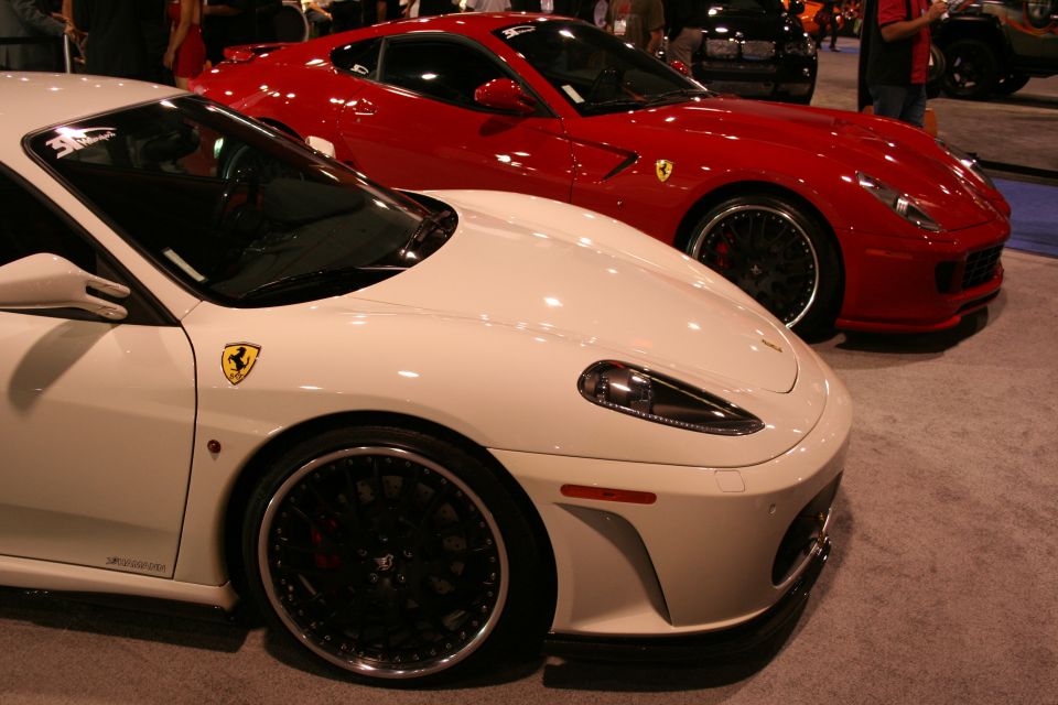 White and red sports cars parked side-by-side