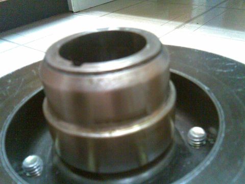 1972 Ford Ranchero - A close-up view of a metal component, possibly a brake rotor hub, with visible bolts.