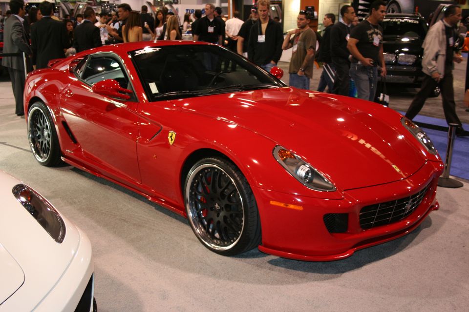 Red Ferrari 599 GTB Fiorano front 3/4 view with custom wheels