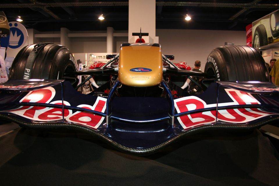 Front view of a Red Bull F1 car with gold nose cone and large tires