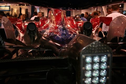 Race car interior with red and blue abstract paint on bodywork and a grid of lights