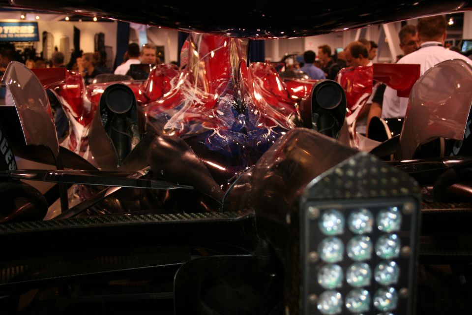 Race car interior with red and blue abstract paint on bodywork and a grid of lights