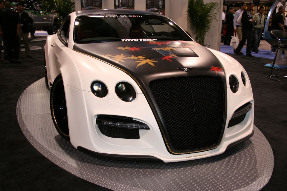 White custom Bentley Continental GT with maple leaf graphics on hood and TOYO TIRES banner