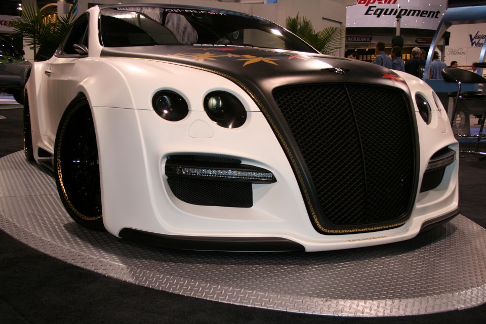 White Bentley Continental GT with custom widebody kit and black grille