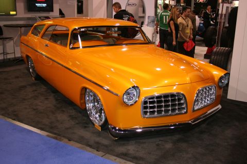 Orange custom shooting-brake wagon hot rod at an auto show