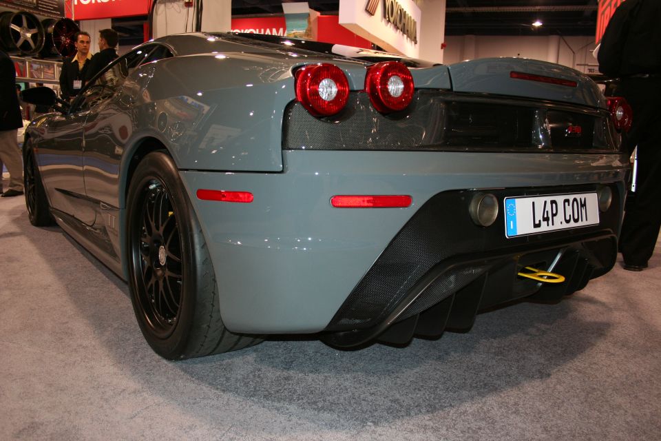 Grey Ferrari F430 Scuderia rear view with L4P.COM plate at an auto show