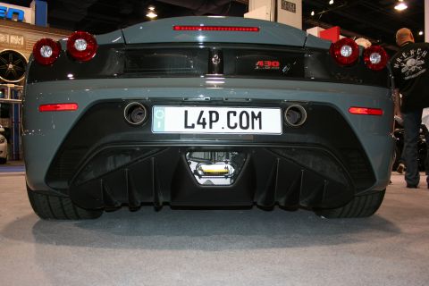 Grey Ferrari 430 Scuderia rear bumper and diffuser at an auto show