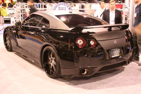 Black Nissan GT-R rear three-quarter view at an auto show