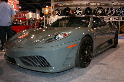 Grey Ferrari 430 Scuderia front three-quarter view at an auto show