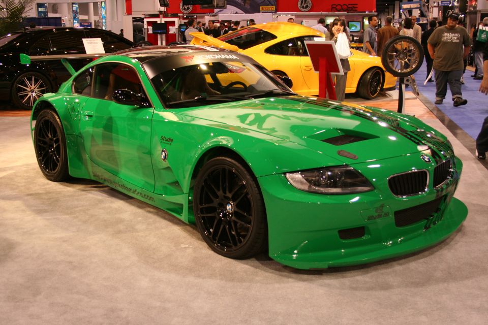 Green BMW Z4 race car front three-quarter view at an auto show