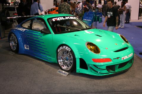 Green and blue Falken Porsche 911 GT3 race car front three-quarter view