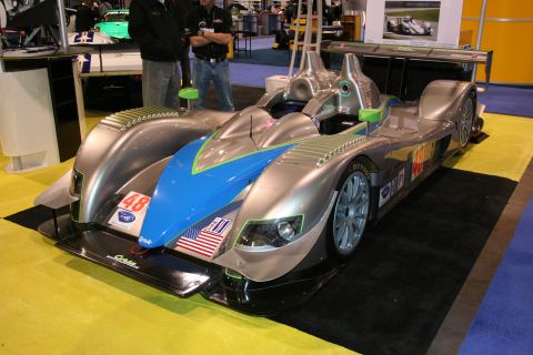 Silver and blue Le Mans prototype race car front three-quarter view