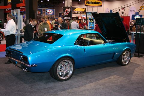 Blue first-gen Camaro custom rear three-quarter at trade show