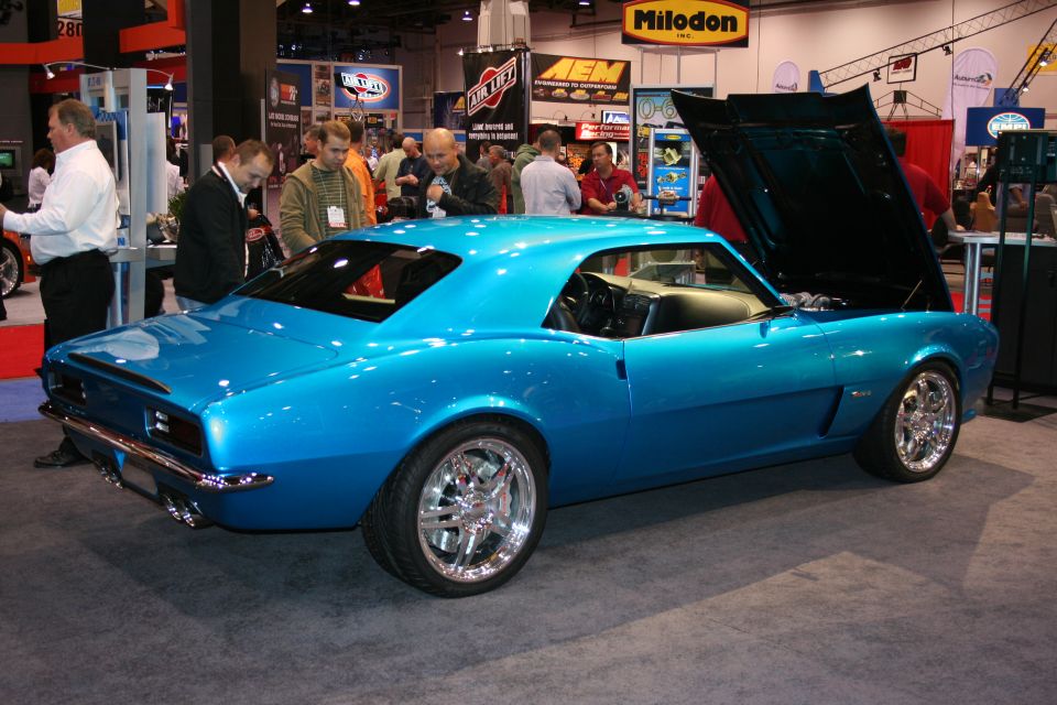 Blue first-gen Camaro custom rear three-quarter at trade show