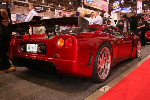Dark red Factory Five supercar rear three-quarter view at a show