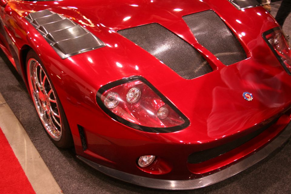 Close-up of red Factory Five GTM supercar front clip and headlight