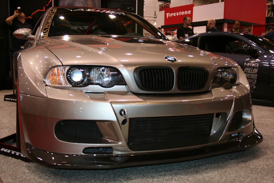 Silver widebody BMW E46 M3 front view with splitter at a show