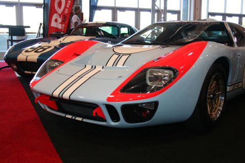 White and red Ford GT40 replica with racing stripes, front view