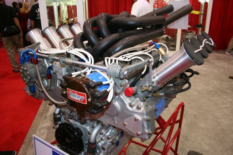 Close-up of a V8 engine with Mallory ignition and custom intake stacks