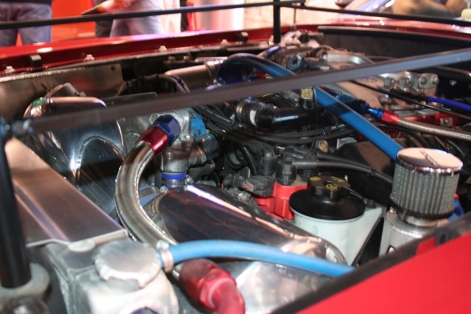 Polished engine bay with braided fuel lines and air filter