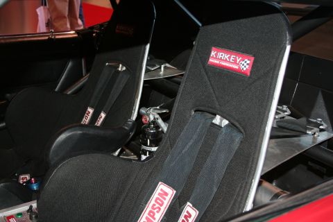 Two Kirkey racing seats with Simpson harnesses in a race car