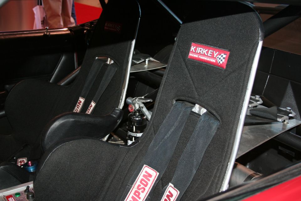 Two Kirkey racing seats with Simpson harnesses in a race car