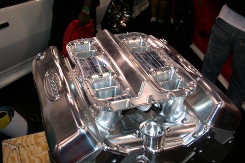 Chrome engine intake manifold with dual carburetors