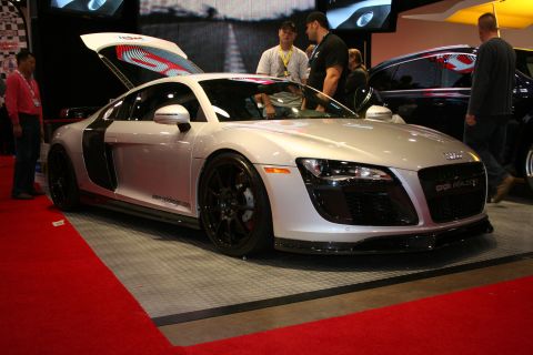 Silver Audi R8 with doors open at a car show