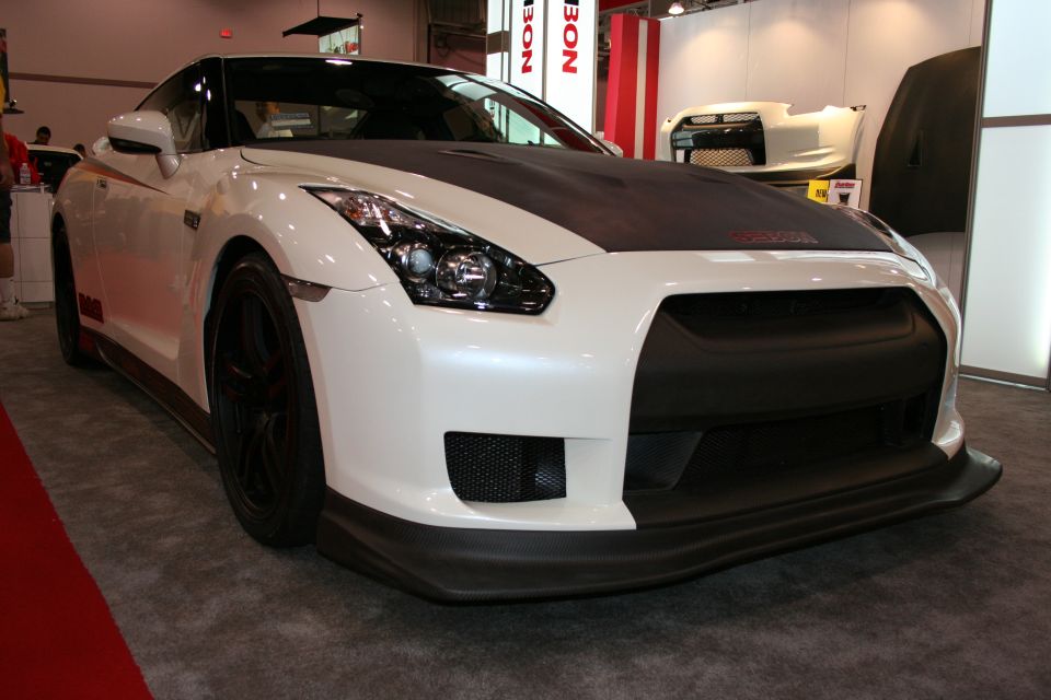 White Nissan GT-R with carbon fiber hood and front splitter