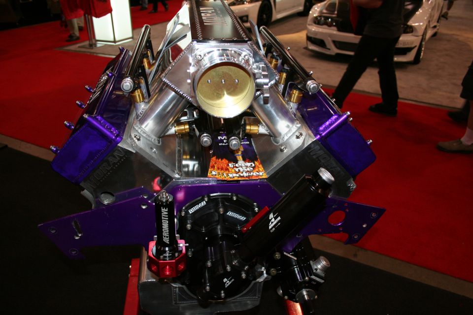 Custom V8 engine with purple valve covers and polished intake manifold