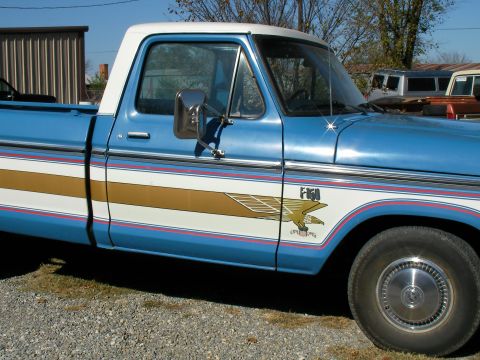 1976 Ford F-150 - This pickup truck features a distinctive eagle decal on its side, along with F-150 badging.