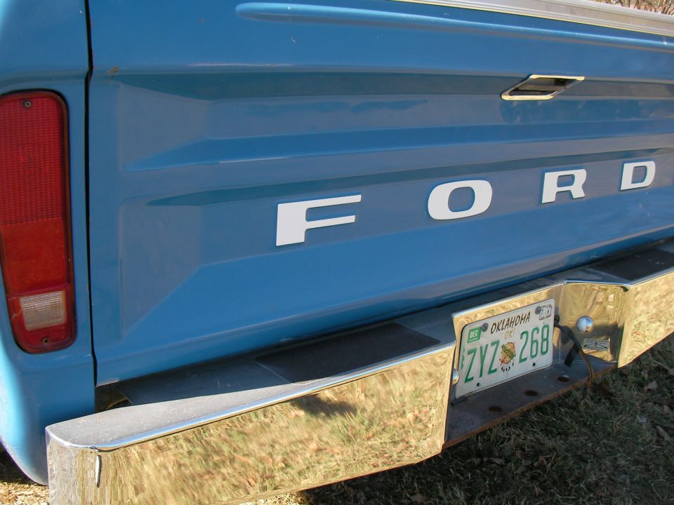 Blue Ford pickup truck rear, chrome bumper, Oklahoma license plate ZYZ 268