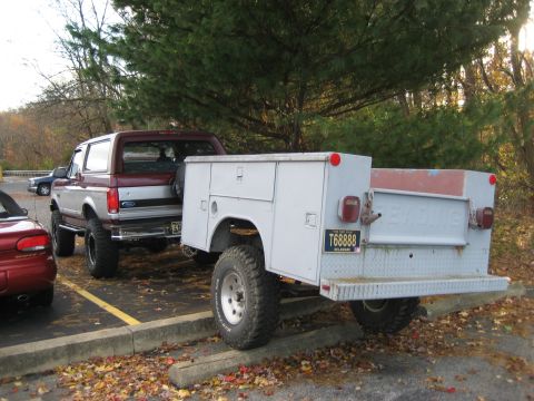 1996 Ford Bronco - A 1996 Ford Bronco is seen from the rear, hitched to a utility trailer with a Delaware license plate.