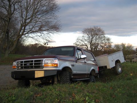 1996 Ford Bronco - This 1996 Ford Bronco is equipped with an aftermarket bumper and tows a utility trailer.