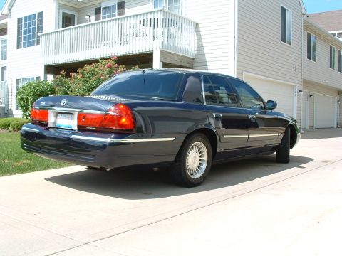 1999 Mercury Grand Marquis - This 1999 Mercury Grand Marquis sedan is shown from the rear three-quarter angle.