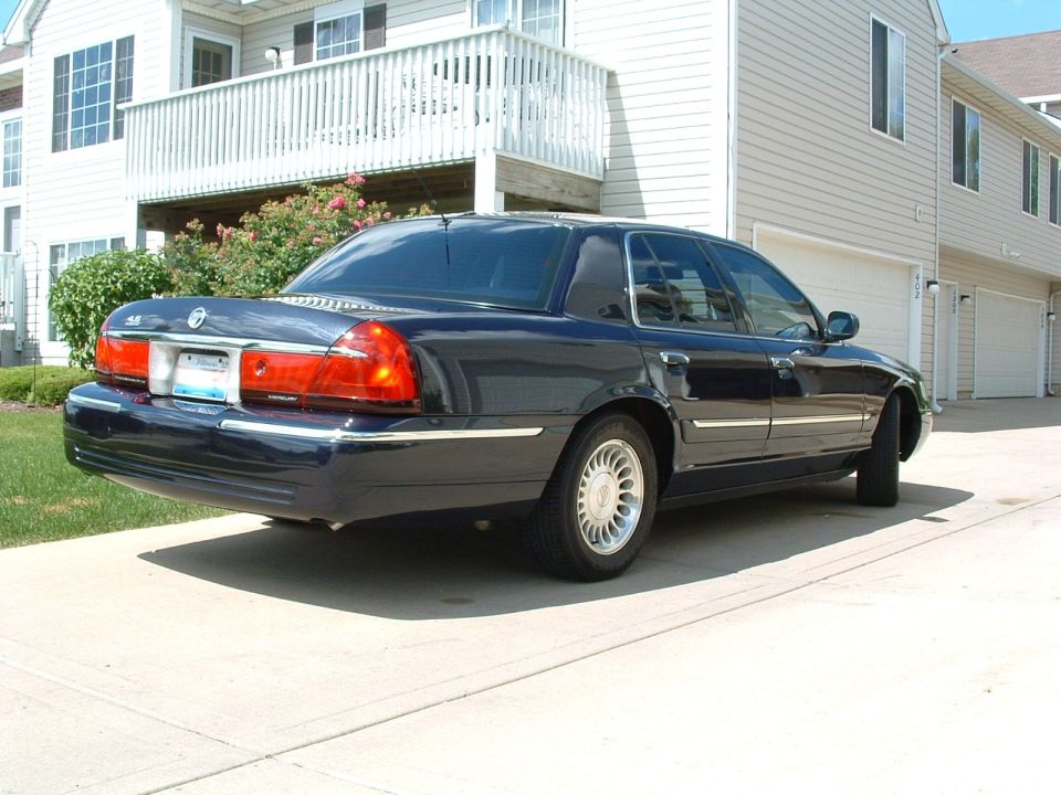 Dark blue 1999 Mercury Grand Marquis sedan, rear 3/4 view