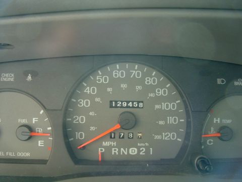 1999 Mercury Grand Marquis - The car's odometer reads 129,458 miles and the speedometer shows 17 mph.