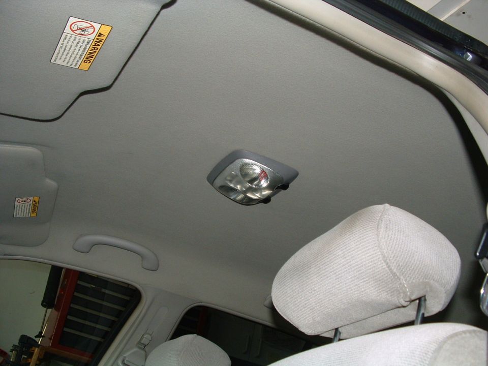 Interior ceiling light and headrest in a car
