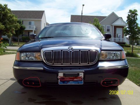 1999 Mercury Grand Marquis - Frontal view of a dark blue sedan, captured on July 3, 2008, showing its grille and headlights.