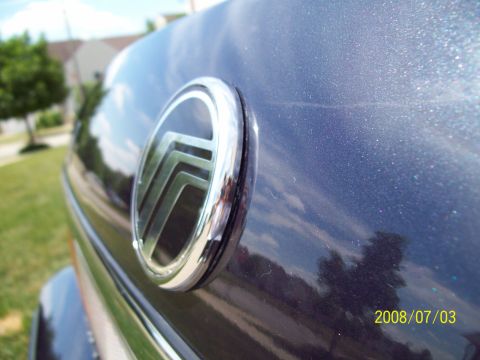 1999 Mercury Grand Marquis - Mercury emblem on the trunk of a car, with a date stamp from 2008.