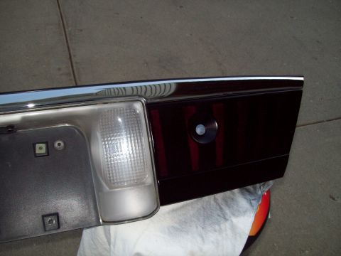 1999 Mercury Grand Marquis - This is a close-up view of a car's tail light assembly, showing the lens and surrounding trim.